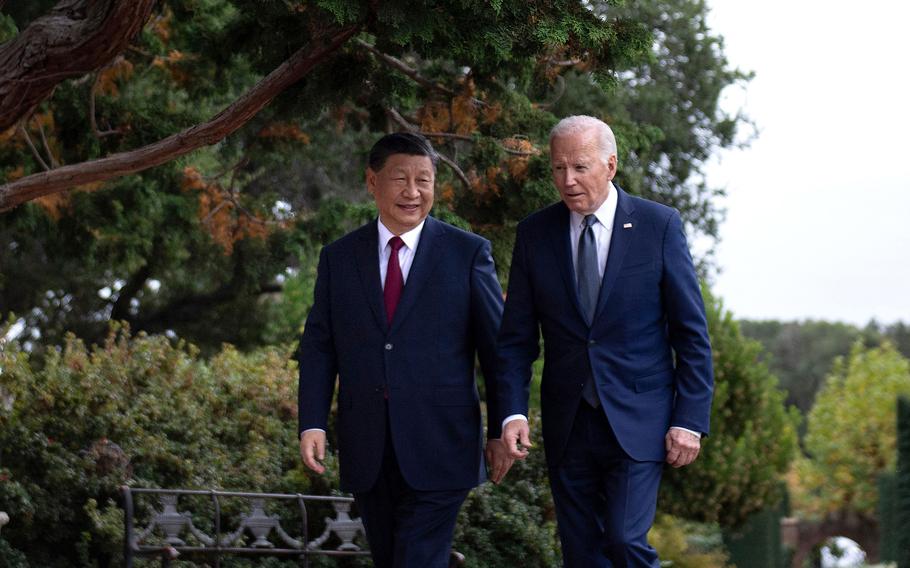 President Joe Biden, right, and Chinese President Xi Jinping walk together after a meeting during the Asia-Pacific Economic Cooperation (APEC) Leaders’ week in Woodside, Calif., on Nov. 15, 2023.