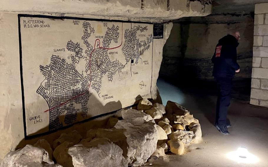 The cave system underneath Maastricht, Netherlands, shown here during a tour on Feb. 27, 2023, once stretched for 155 miles. Everything to the left of the red line disappeared after the construction of a stone quarry.