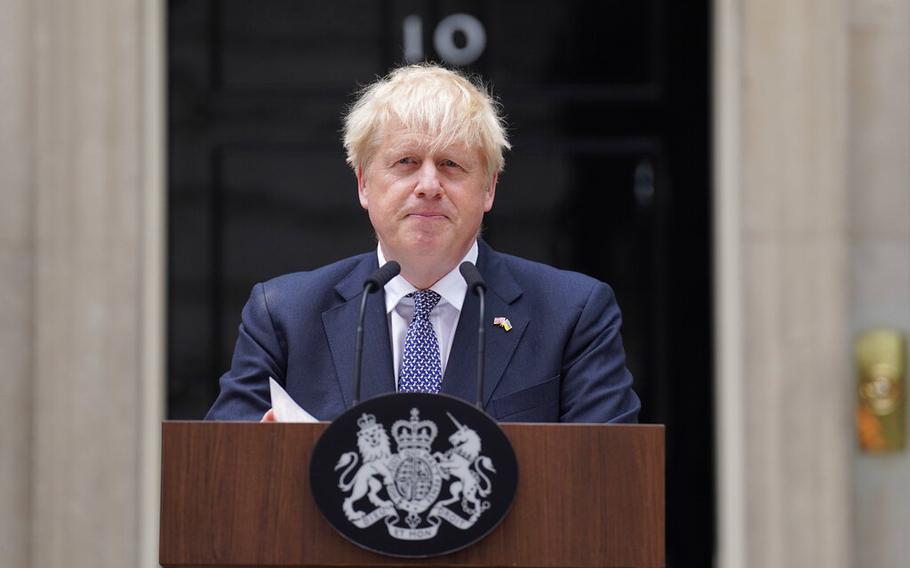 Prime Minister Boris Johnson reads a statement outside 10 Downing Street, London, formally resigning as Conservative Party leader, in London, Thursday, July 7, 2022. Johnson said Thursday he will remain as British prime minister while a leadership contest is held to choose his successor. 
