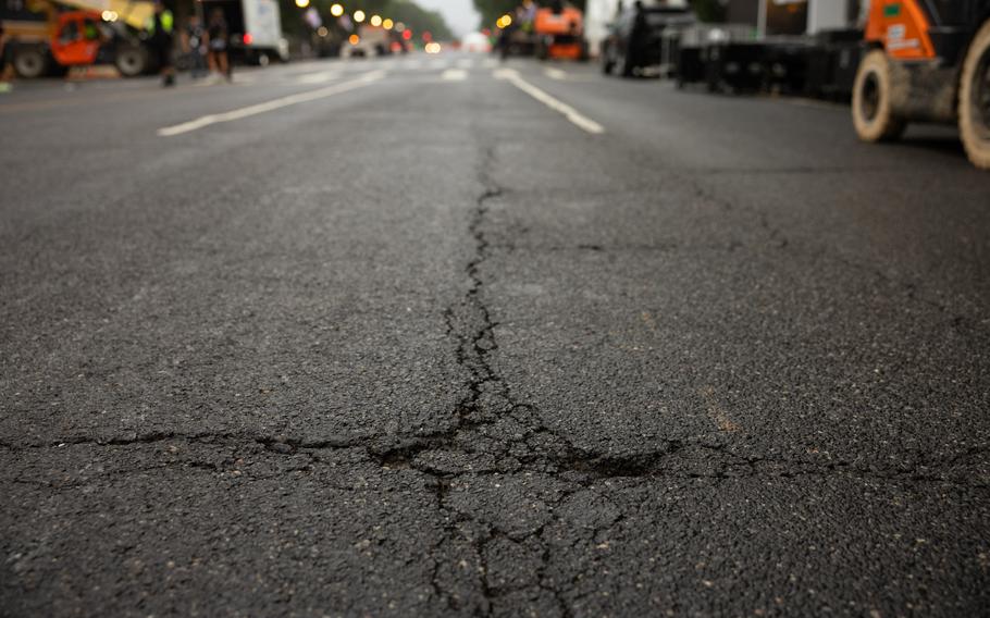 Small dents and cracks in the road can be seen.