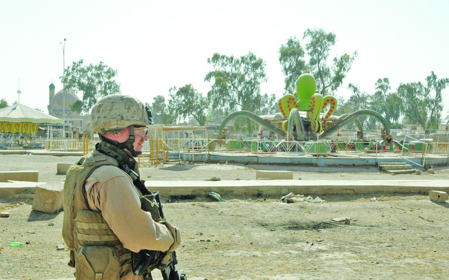 Sgt. Tim Wittmer searches an abandoned amusement park in Fallujah, July 2006.