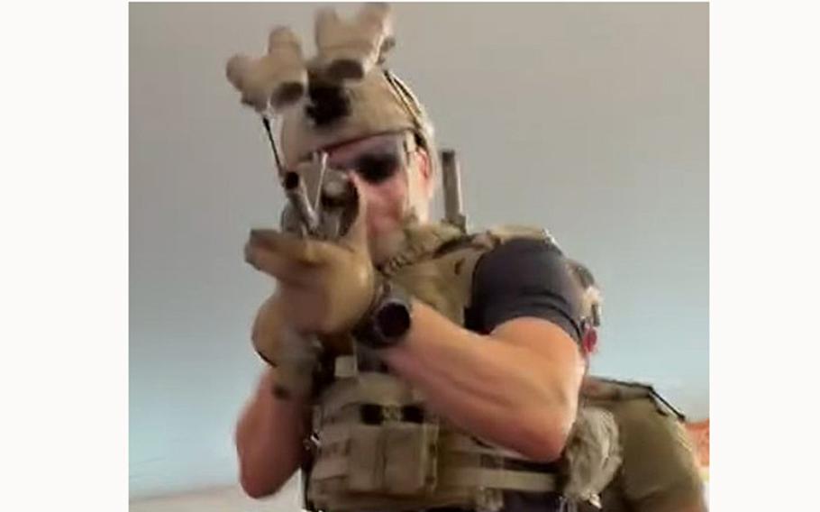 A video screen grab shows a Navy SEAL holding a paintball gun at an event in Barnstead, N.H., on July 12, 2024.