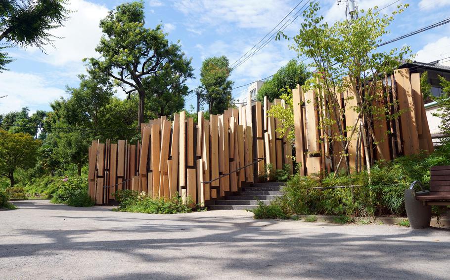 Eared cedar boards, iconic of architect Kengo Kuma's designs, are used outside and inside of each separately built restroom, which together resemble a village full of greenery inside Tokyo's Nabeshima Shoto Park. 