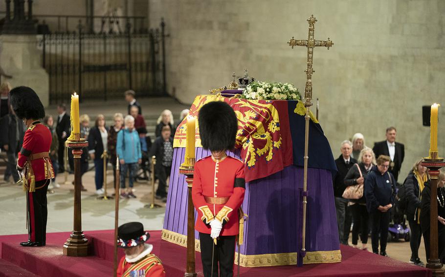 The coffin of Queen Elizabeth II lies in state inside Westminster Hall. 