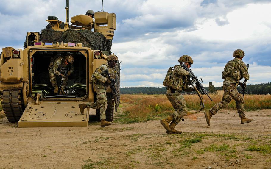 U.S. soldiers assigned to 3rd Armored Brigade Combat Team, 4th Infantry Division, dismount an M2A3 Bradley Fighting Vehicle during an exercise at Drawsko Pomorskie, Poland, in July 6, 2022. A report released this month by the Association of the U.S. Army says that funding isn't keeping up with the Army's operational burden.