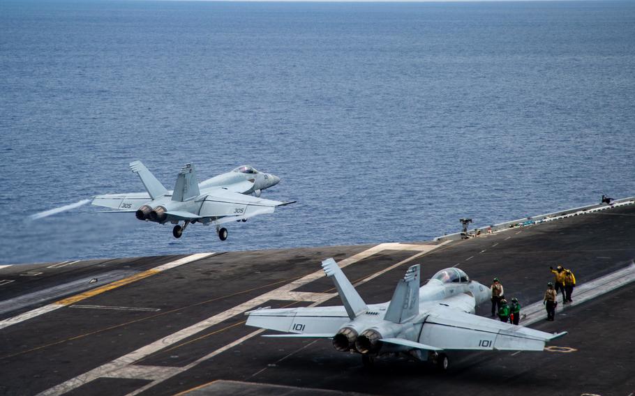 An F/A-18E Super Hornet launches off the flight deck of USS Harry S. Truman, July 30, 2022. The Navy has recovered one of the jets, which was swept overboard during unexpectedly heavy weather in the Mediterranean Sea, July 8. 