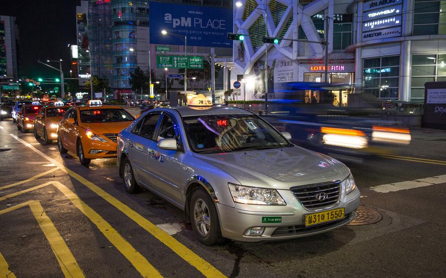Taxis await clients in Seoul, South Korea, Aug. 8, 2015.