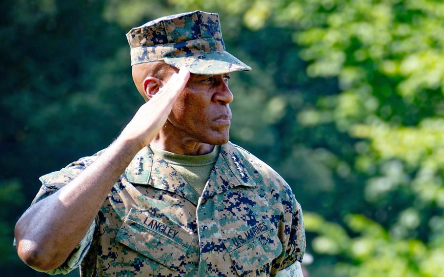 Marine Gen. Michael Langley salutes.