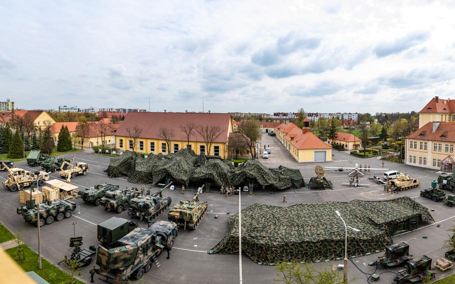 U.S. and Polish troops prepare their equipment displays for the European Rocket Artillery Summit in Torun, Poland, April 18, 2023. 