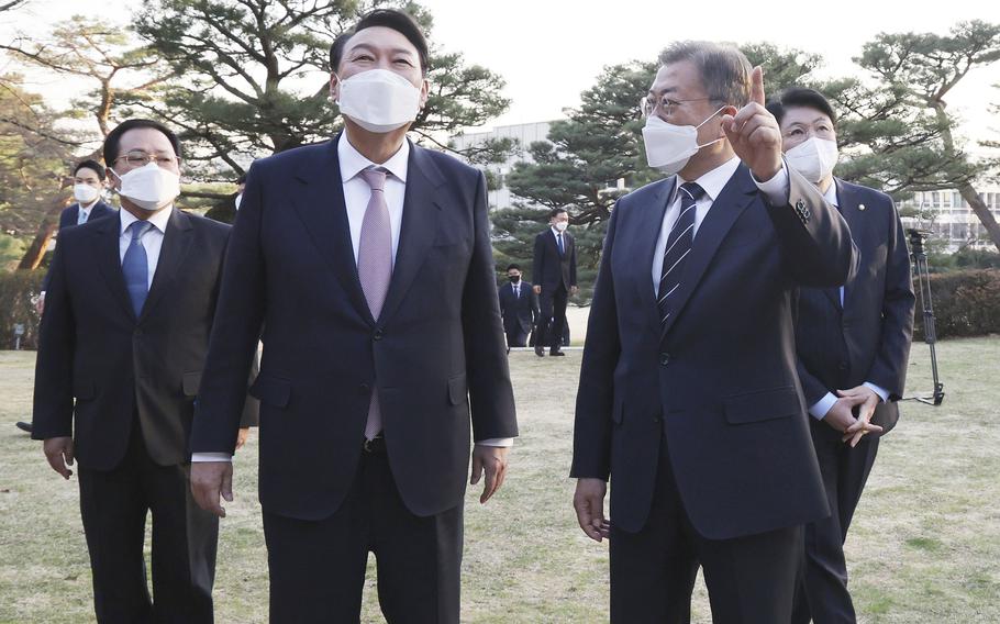 South Korean President-elect Yoon Suk Yeol, second from left, and South Korean President Moon Jae-in, second fro right, talk before their meeting at the presidential Blue House in Seoul, South Korea on March 8, 2022. rs encountered at the start of their presidencies.