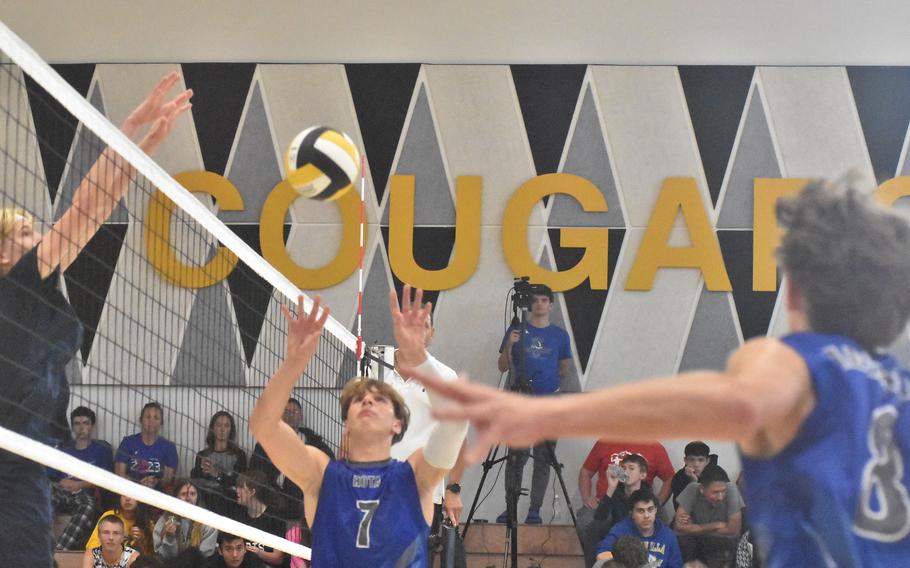 Rota’s Christian Weaver sets the ball up for an oncoming Tyler DeMeritt while Black Forest’s Timothy Sivonen is ready for a quick set over the net during the Falcons’ victory in the DODEA-Europe boys volleyball championships on Saturday, Oct. 28, 2023.
