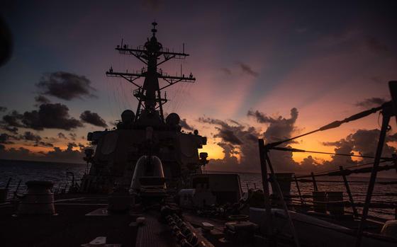 The guided-missile destroyer USS Curtis Wilbur steams through the South China Sea, Thursday, May 20, 2021. 