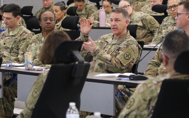 Col. Christopher Hunter, deputy commander, 364th Expeditionary Sustainment Command, briefs Soldiers as they embark on their culminating training exercise in February 2024 at Fort Knox, Kentucky. The 364th ESC will staff the 1st Theater Sustainment Command's forward operational command post in Kuwait.