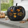 Balsam Hill’s jack-o-lantern with a feline face. Cats, celestial imagery and ravens are decorative elements that have a cool Halloween vibe without being overly scary.