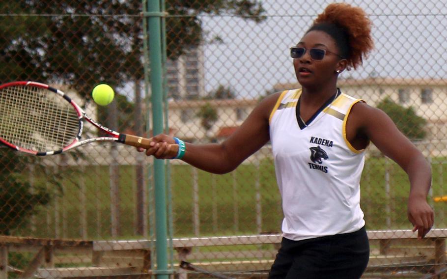 Kadena's Destiny Richardson hits a forehand return during Thursday's Okinawa tennis matches. Richardson teamed with Iain Stanley in an 8-5 loss to Kubasaki's Josh Wall and Isabella Suber in mixed doubles.