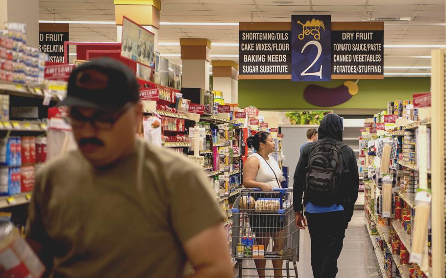 Commissary patrons looking for supplies following Typhoon Mawar move through the aisles at Andersen Air Force Base, Guam,  May 28, 2023