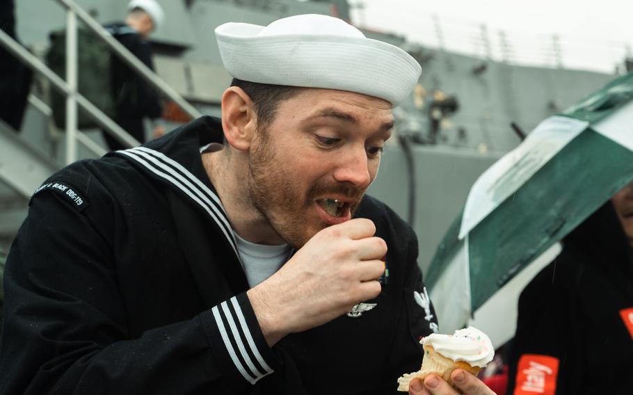 A USS Delbert D. Black sailor enjoys a cupcake after returning to Naval Station Mayport, Fla., on Sunday, Feb. 18, 2024.