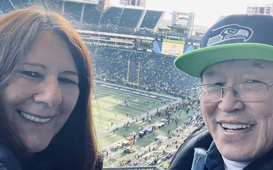 Vietnam veteran Bill Jarvinen and Sheri Nickel, his wife, at a Seattle Seahawks football game in 2022. 