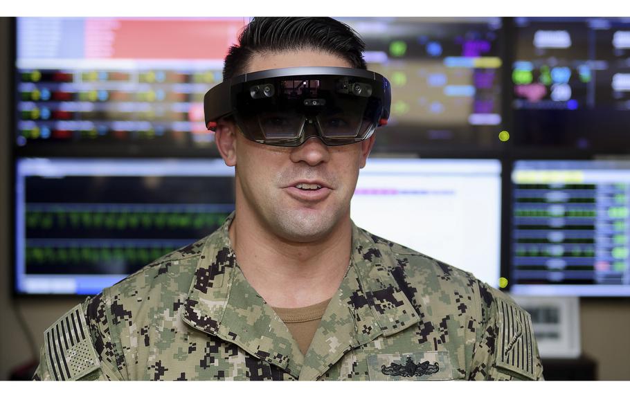 A Navy Information Systems Technician demonstrates the Hololens holographic display headset during an event at Navy Medicine West in San Diego.