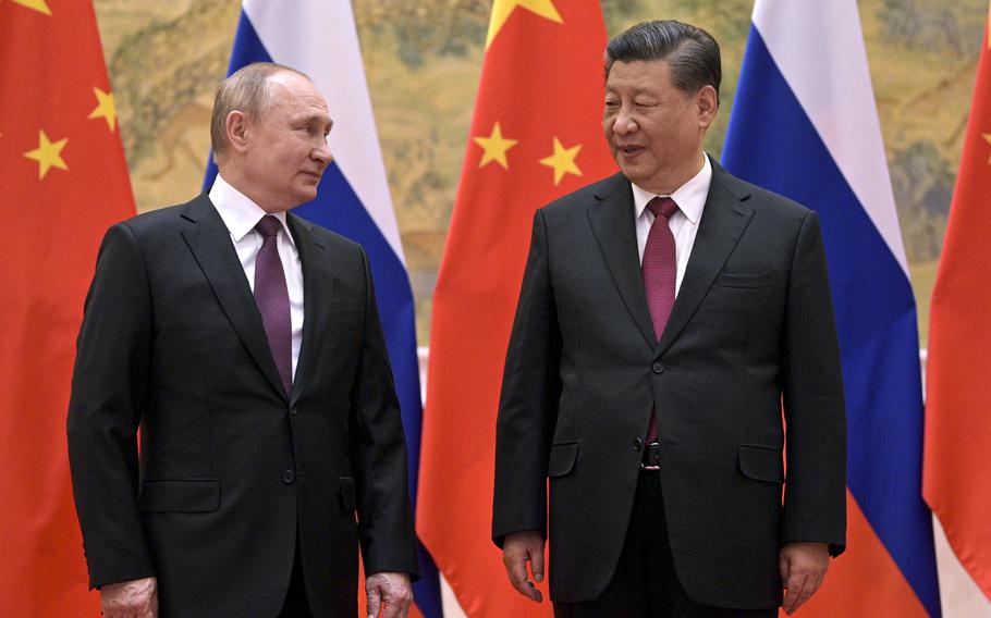 Chinese President Xi Jinping, right, and Russian President Vladimir Putin talk during their meeting in Beijing, China, Friday, Feb. 4, 2022. With Russia’s military failings in Ukraine mounting, no country is paying closer attention than China to how a smaller, outgunned force has badly bloodied what was thought to be one of the world’s strongest armies.