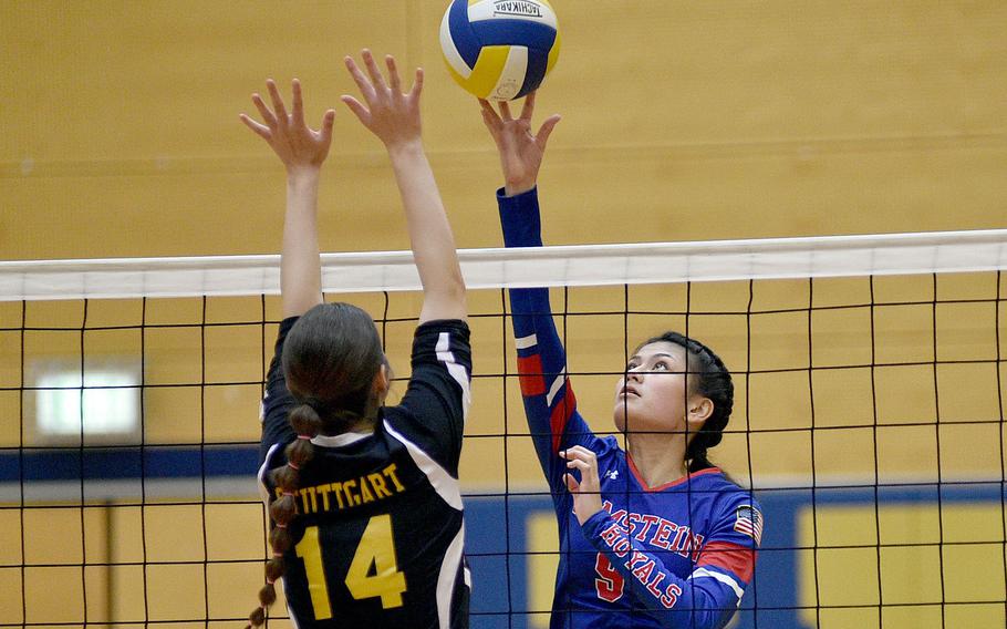 Ramstein senior Sophia Schluth dinks the ball over Stuttgart's Hannah Holmes during a Sept. 9, 2023, match at Wiesbaden High School in Wiesbaden, Germany.