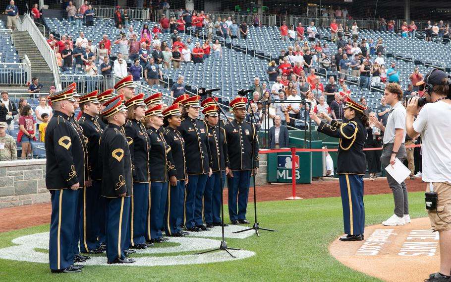 The United States Army Band “Pershing’s Own” Chorus performs the national anthem during U.S. Army Day at Nationals Park in Washington, D.C., on Friday, June 16, 2023. The Nationals hosted the Miami Marlins.