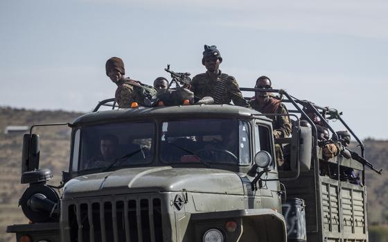 FILE - Ethiopian government soldiers ride in the back of a truck on a road near Agula, north of Mekele, in the Tigray region of northern Ethiopia on May 8, 2021. Authorities in Ethiopia's northern Tigray region alleged Wednesday, Aug. 24, 2022 that Ethiopia's military launched a "large-scale" offensive for the first time in a year, while Ethiopia's military spokesman did not immediately respond to questions. (AP Photo/Ben Curtis, File)