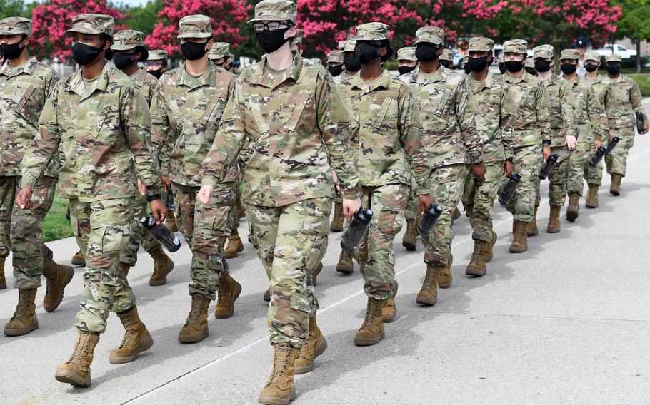 Air Force trainees march in formation during a drill session at Keesler Air Force Base, Miss., in July 2020. Researchers concluded in a study that lower female fitness levels at basic training were likely an important factor in the higher injury rates of women in the military.