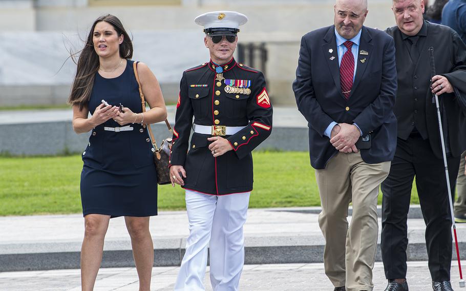 Medal of Honor recipient medically retired Marine Cpl. Kyle Carpenter exits the U.S. Capitol grounds after attending a lying in honor ceremony for WWII MOH recipient Hershel Woodrow "Woody" Williams on July 14, 2022, in Washington.