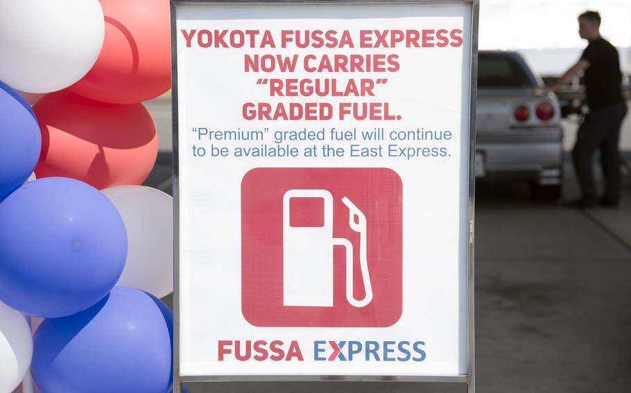 A customer fuels up with regular-grade gas at the Fussa Express on Yokota Air Base, Japan, Wednesday, April 12, 2023. 