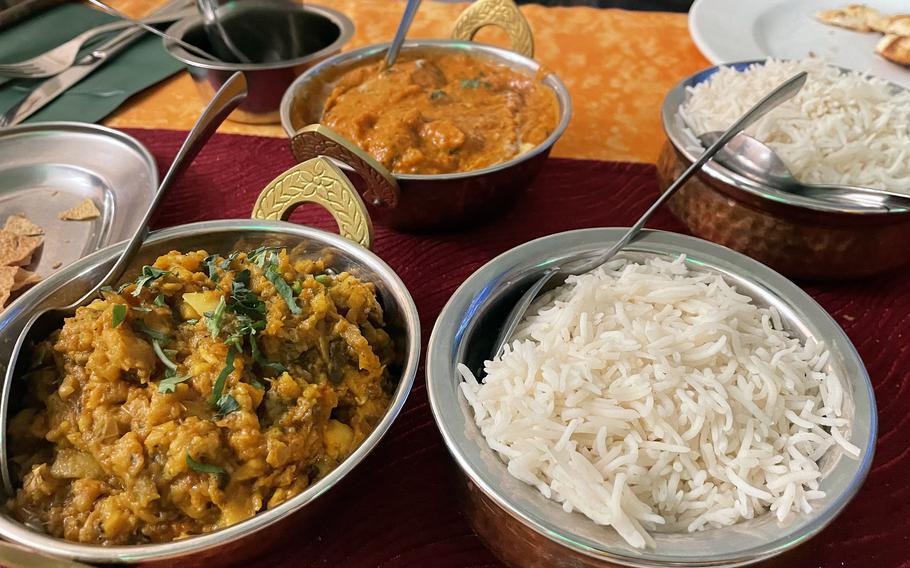 The vegetarian baingan bharta and the chicken tikka masala with garlic naan are among the meals made fresh at Restaurant Vaishnavi in Homburg, Germany.