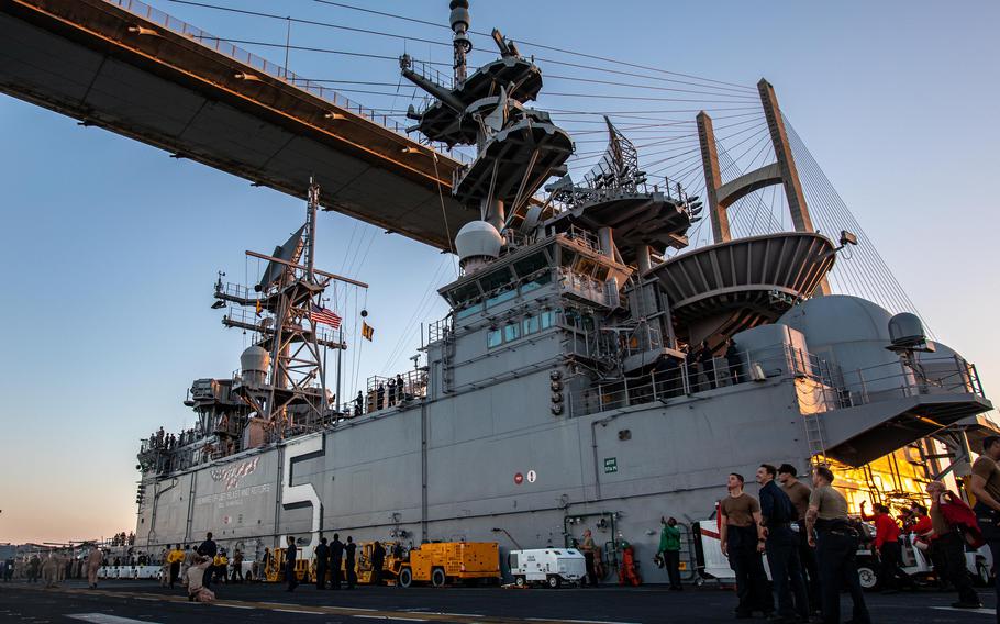 The amphibious assault ship USS Bataan passes under a bridge as it transits the Suez Canal with the 26th Marine Expeditionary Unit on Aug. 6, 2023. 