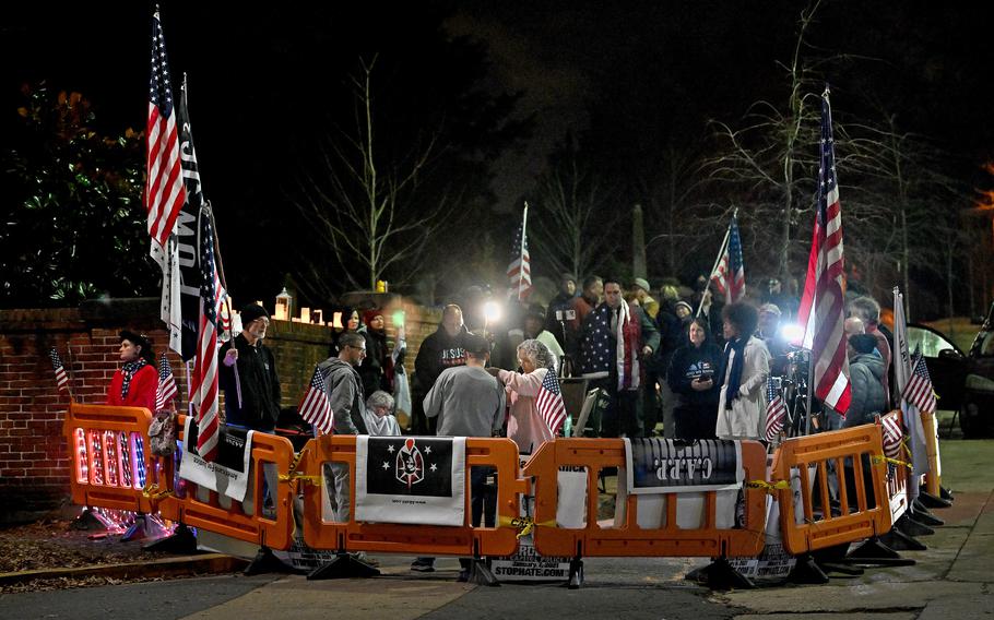 Demonstrators gather Jan. 5, 2022, outside of a jail where a group of defendants charged in the Jan. 6, 2021, attack on the U.S. Capitol are being held in D.C. 