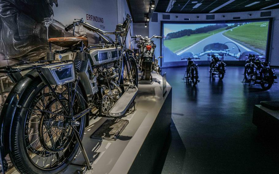  A 1910 NSU V-Twin, left, opens the video theater exhibit at the German Motorcycle Museum in Neckarsulm, Germany. The theater allows visitors to get up close with real vintage motorcycles, sitting on them while watching a point-of-view rider documentary video.