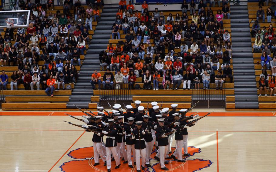 Marine Corps Silent Drill Platoon performs a sequence.