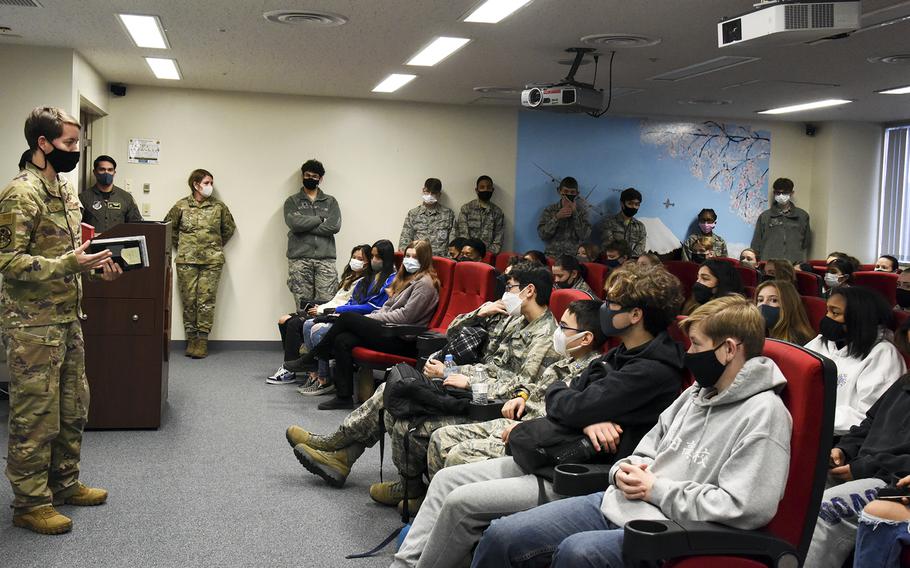 Col. Julie Gaulin, vice commander of the 374th Airlift Wing, speaks to Yokota High School students about women in aviation at Yokota Air Base, Japan, Tuesday, March 8, 2022. 