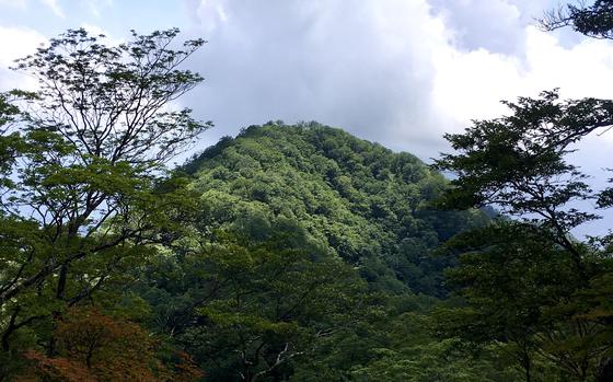 Views of neighboring peaks in the Tanzawa range are part of the trek up Mount Hinokiboramaru in Kanagawa prefecture, Japan.