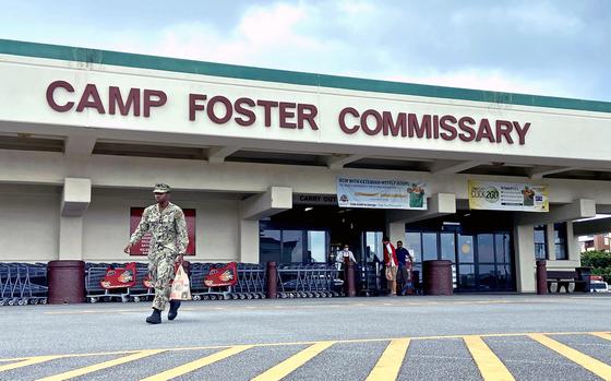 A shopper walks out of the commissary on Camp Foster, Okinawa, Friday, Sept. 9, 2022.