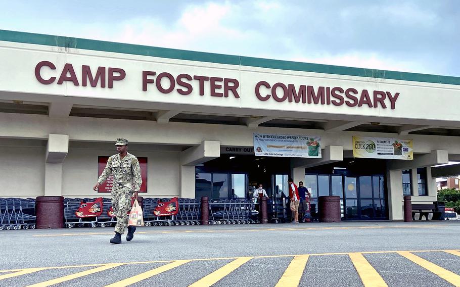 A shopper walks out of the commissary on Camp Foster, Okinawa, Friday, Sept. 9, 2022.
