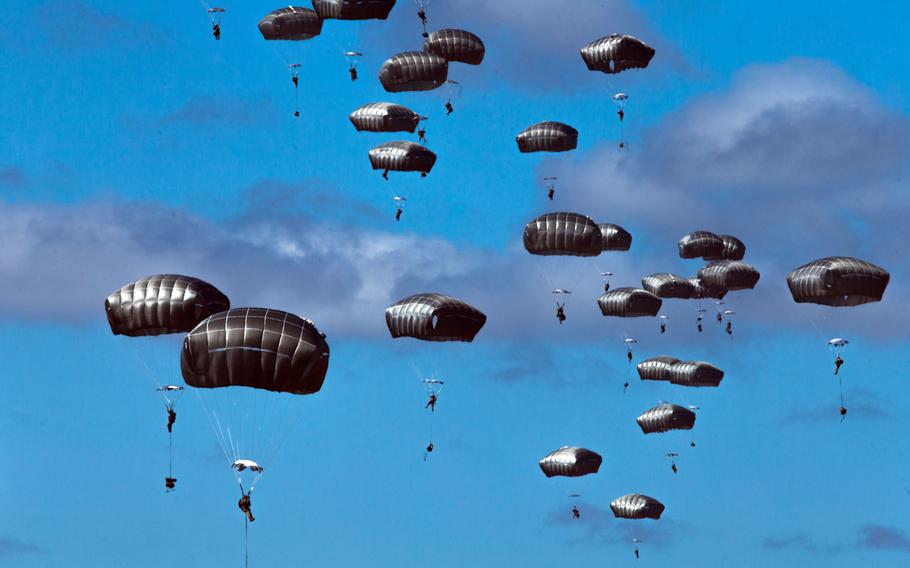 U.S. Army paratroopers jump onto a drop zone during the Talisman Sabre exercise in Queensland, Australia, Wednesday, July 28, 2021. 