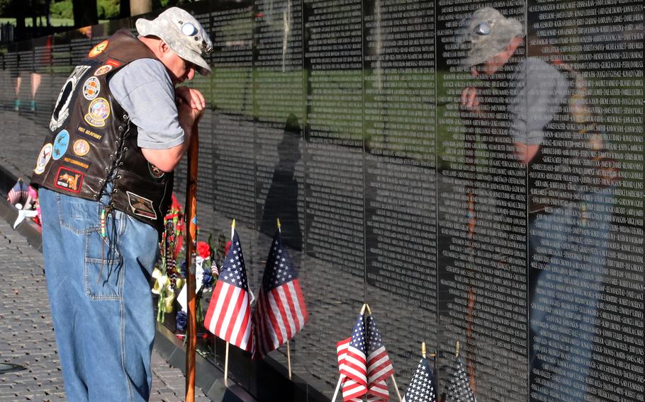 Army veteran Bernie Klomanek of Mineral, Va. remembers the fallen during a Memorial Day visit to the Vietnam Veterans Memorial in Washington, D.C., May 31, 2021.