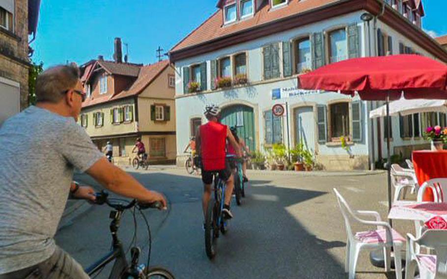 Cyclists ride up a hill as they leave Bad Duerkheim, Germany, on Weinstrasse Experience Day on Aug. 25, 2019. The event, which was expected to attract some 400,000 visitors this year, has been canceled because of the coronavirus pandemic.