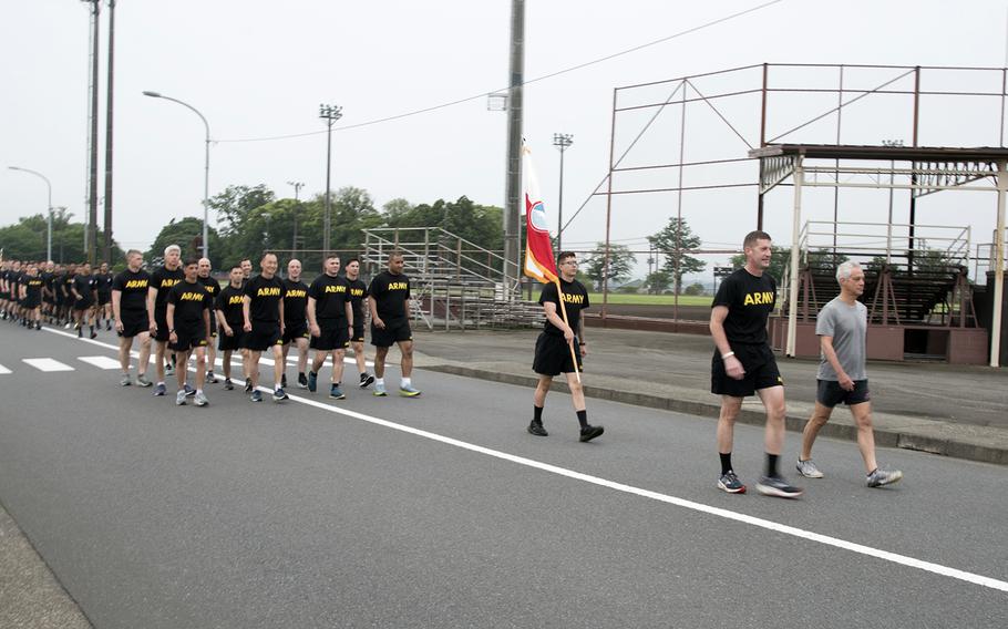 Maj. Gen. Joel “JB” Vowell, commander of U.S. Army Japan, and U.S. Ambassador to Japan Rahm Emanuel prepare to lead troops on a 3-mile run at Camp Zama, Japan, Wednesday, June 14, 2023. The event honored the Army's 248th birthday.