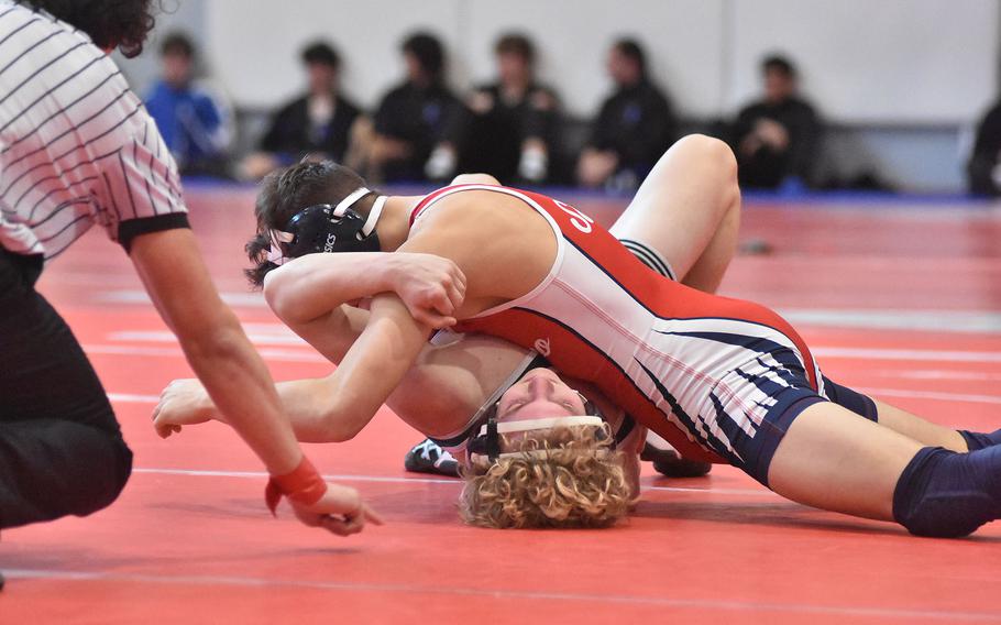 Aviano's Joshua Barthold gets set to pin Naples' Nolan Coats in a 144-pound match Saturday, Feb. 4, 2023, at the DODEA-Europe Southern Europe regional at Aviano Air Base, Italy.