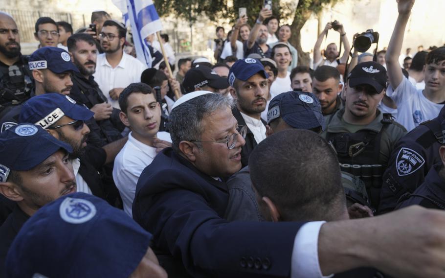 Israel’s National Security Minister Itamar Ben-Gvir, center, attends a march marking Jerusalem Day, an Israeli holiday celebrating the capture of east Jerusalem in the 1967 Mideast war, in front of the Damascus Gate of Jerusalem’s Old City, Thursday, May 18, 2023.