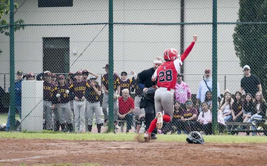 Kaiserslautern’s John Leonard celebrates after scoring the tying run against Stuttgart in what would almost be an upset during the knockout rounds of the 2024 DODEA European baseball championships on May 23, 2024, at Southside Fitness Center on Ramstein Air Base, Germany.