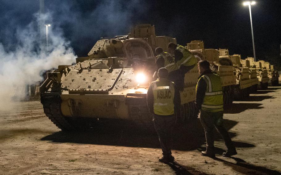 Drivers load Bradley Fighting Vehicles onto a ship in North Charleston, S.C., Jan. 25, 2023. Weapons systems sent to Ukraine, such as the Bradleys, Patriot missiles and Abrams tanks, could eventually be rendered useless because the Pentagon didn't provide a maintenance plan for Ukrainian troops, according to a Defense Department Inspector General report.