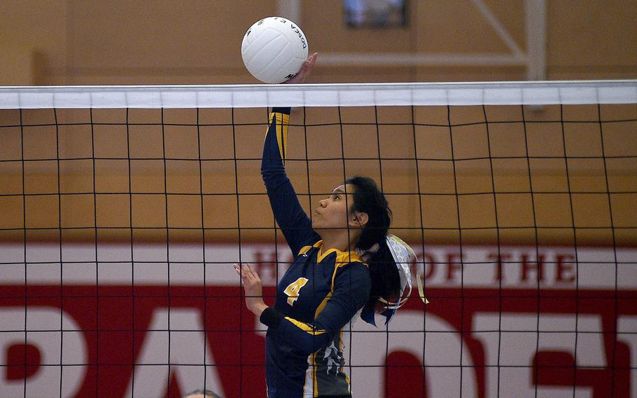 Ansbach's Kylah Tuazon hits the ball during a matchup with Brussels during pool-play action of the DODEA European volleyball championships on Oct. 26, 2023, at Kaiserslautern High School in Kaiserslautern, Germany.