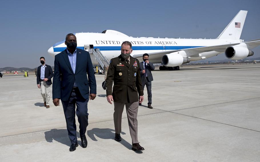 Defense Secretary Lloyd Austin meets with Army Gen. Robert Abrams, commander of U.S Forces Korea, upon arrival at Osan Air Base, South Korea, on March 17, 2021. 