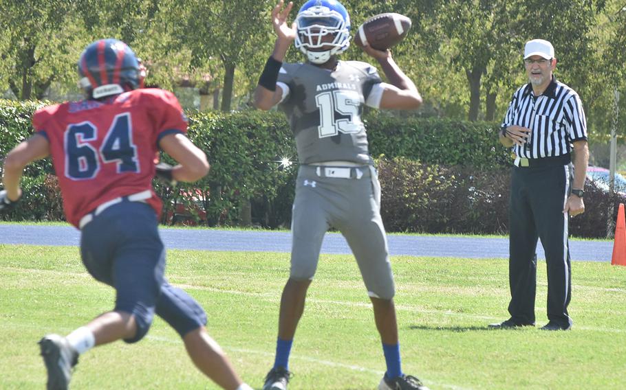 Aviano's Javan Sherrod forces Rota quarterback Anthony Ross to throw the football quicker than he wanted in the Saints 42-0 victory over the Admirals on Saturday, Sept. 10, 2022.